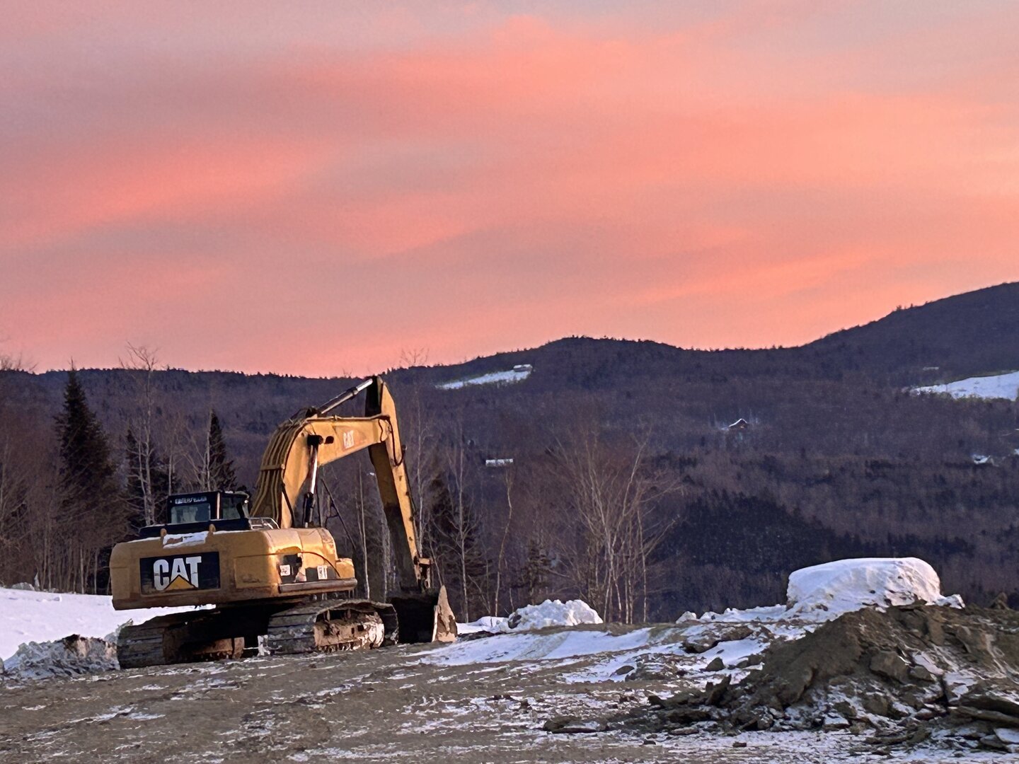 Bucky's Ridge entrance with trail groomer in winter